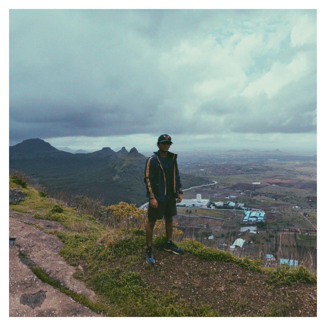 Standing on a ridgeline in the Western Ghats under monsoon cloud